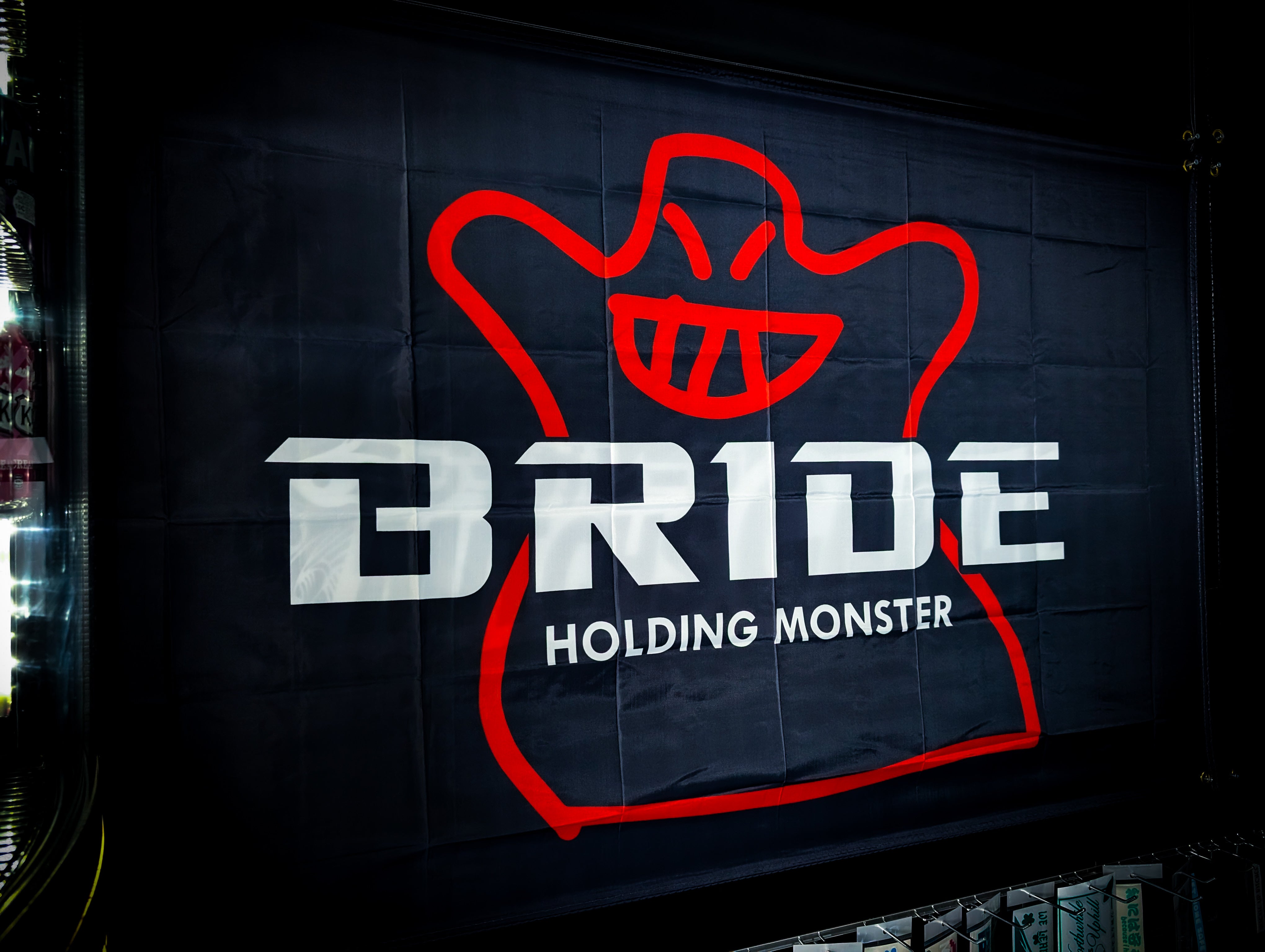 BRIDE Holding Monster Red, Black and White Workshop Banner Flag